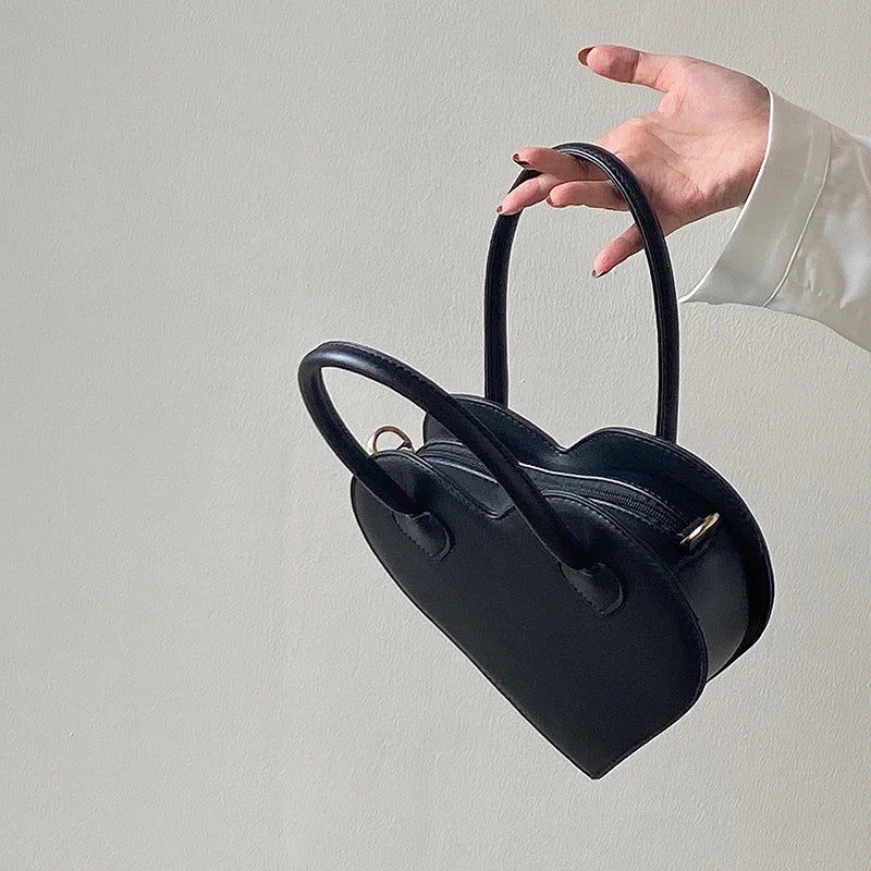 Blakonik | Slayin' the Style Game: Black Leather Heart Hand Bag -